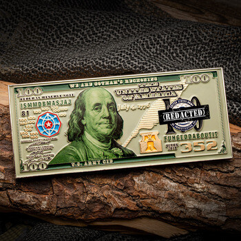 Rectangular custom challenge coin styled like a one hundred dollar bill with Benjamin Franklin, U.S. Army CID details, and REDACTED stamp.