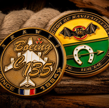 Boeing C-135 military challenge coin featuring aircraft illustration and French air refuelling squadron insignia.